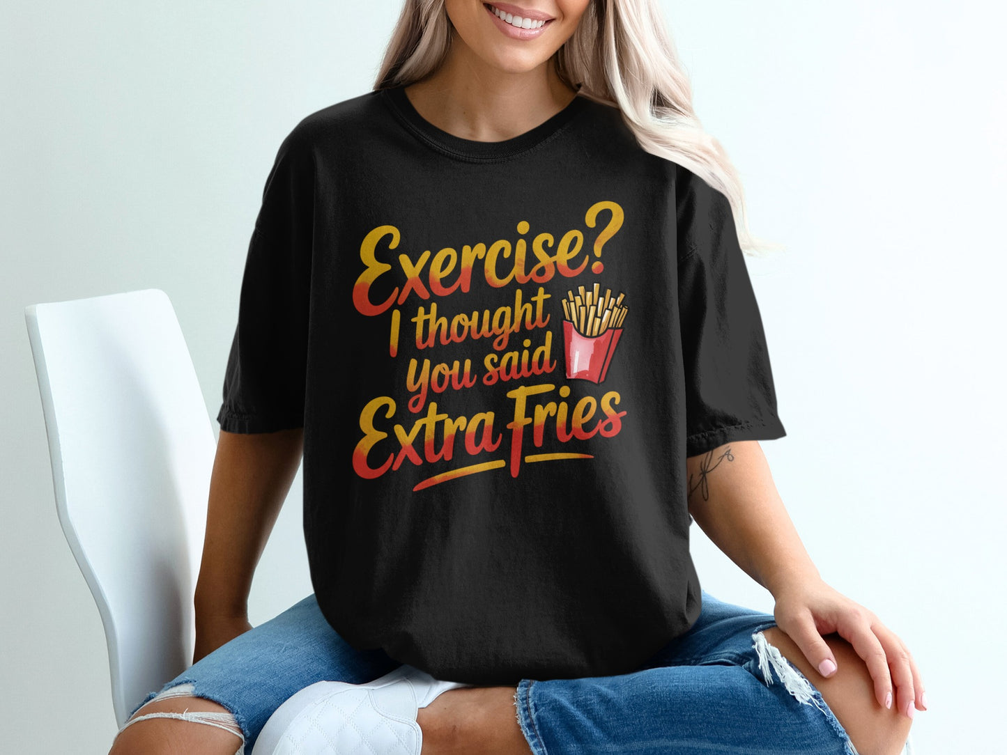 Black t-shirt with "Exercise? I thought you said Extra Fries" text and fries graphic.