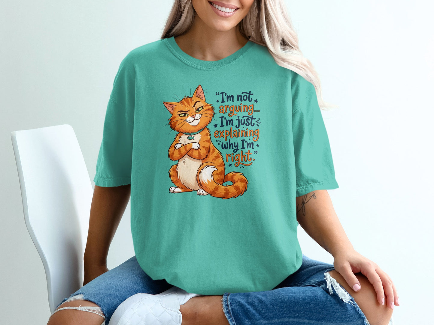 Teal t-shirt with grumpy cat graphic and text "I'm not arguing, I'm just explaining why I'm right."