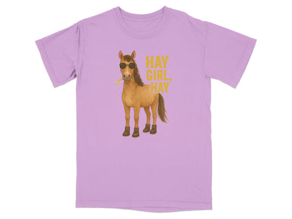 Purple t-shirt with a cartoon horse wearing sunglasses and boots, eating hay.