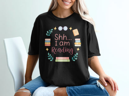 Black t-shirt with "Shh... I Am Reading" text and book graphics.