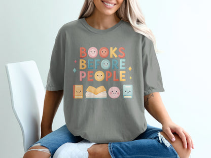 Grey t-shirt with "BOOKS BEFORE PEOPLE" text and book icons.