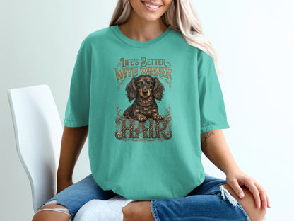 Teal t-shirt with "Life's Better With Wiener" and a dachshund graphic.