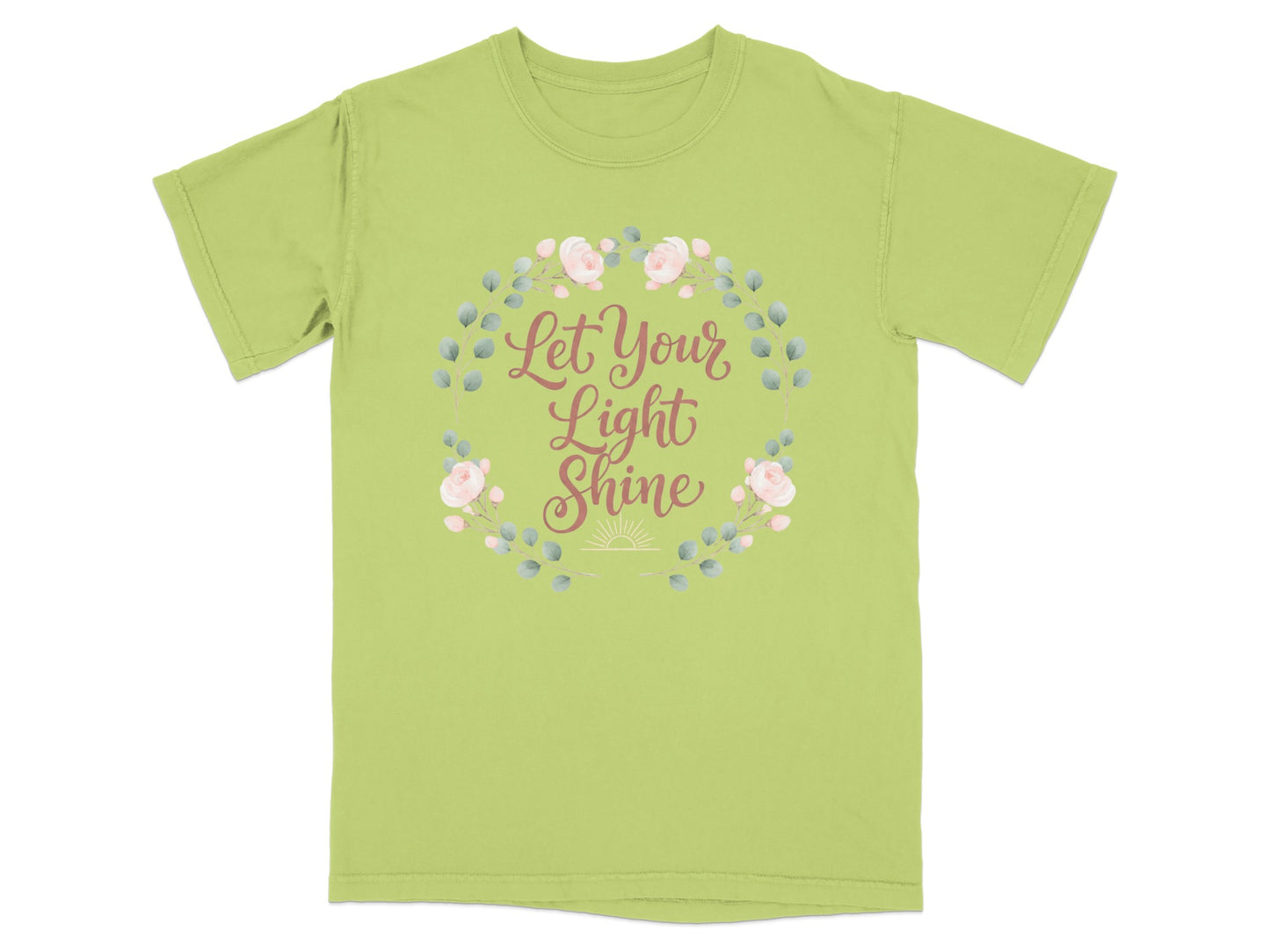 Light green t-shirt with a floral wreath and the text "Let Your Light Shine".