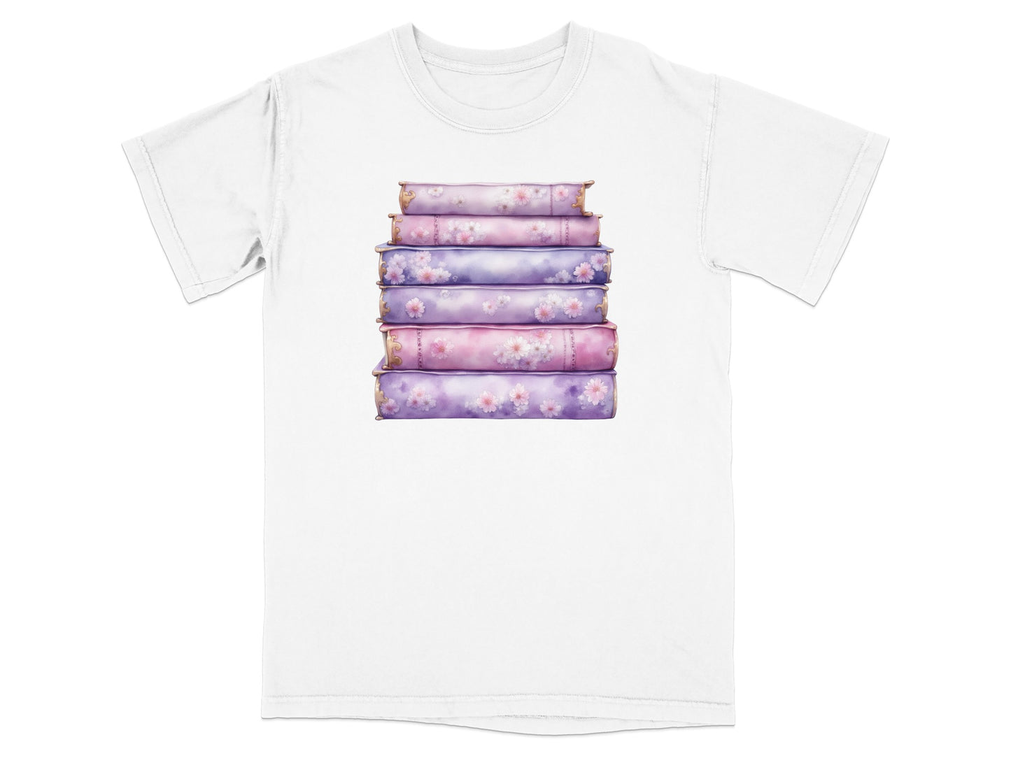 Stack of decorative floral books on a white t-shirt.