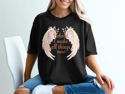 Black t-shirt with "Behold, I make all things new" and wings graphic.