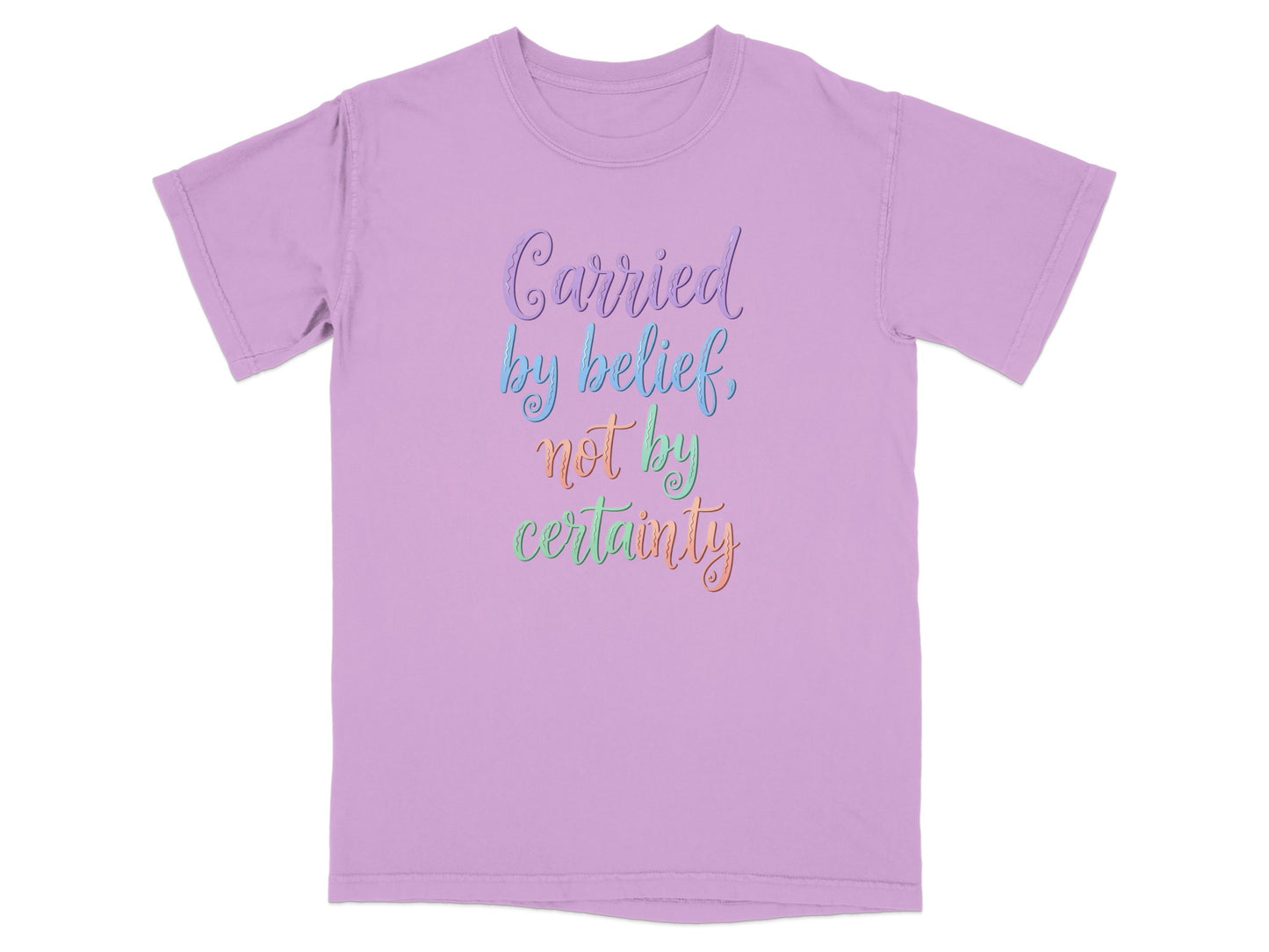 Purple t-shirt with "Carried by belief, not by certainty" in colorful cursive text.