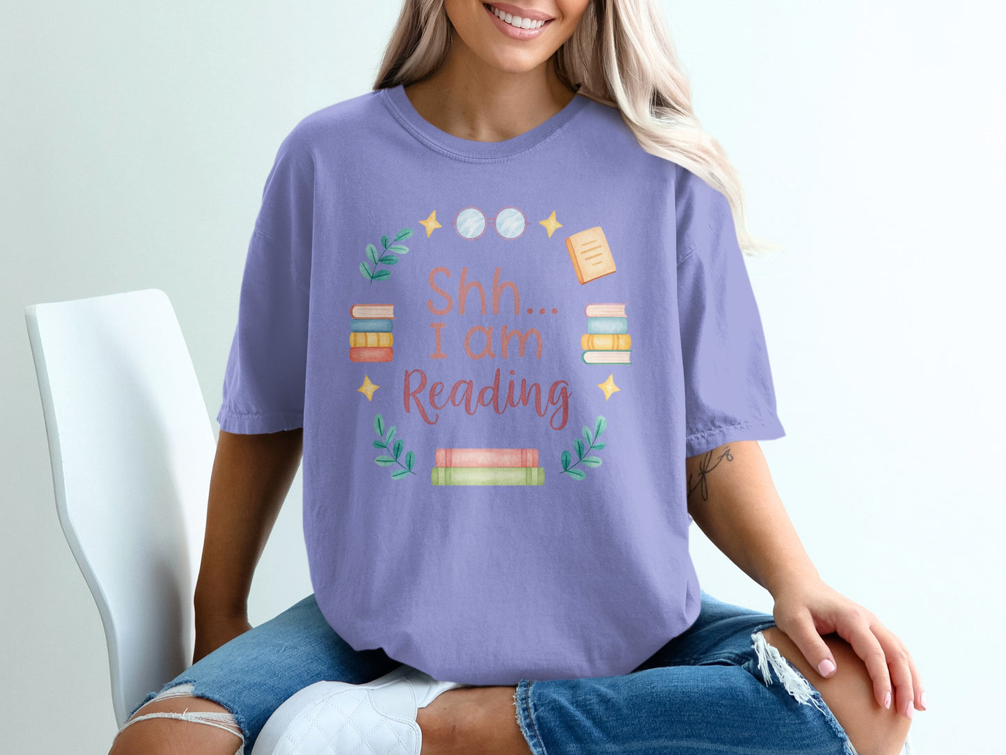 Purple t-shirt with "Shh... I am Reading" text and book graphic.