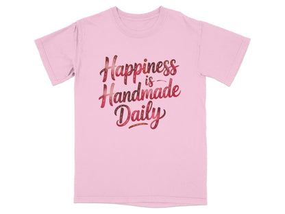 Pink t-shirt with "Happiness is Handmade Daily" text in decorative lettering.