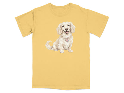 Cream dachshund wearing a heart-shaped tag on a yellow t-shirt.
