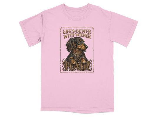 Pink t-shirt featuring a detailed illustration of a dachshund with the text "Life's Better With Hair".