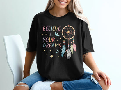 Black t-shirt with "BELIEVE in YOUR DREAMS" and dreamcatcher graphic.