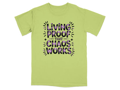 Light green t-shirt with "Living Proof That Chaos Works" in purple text.