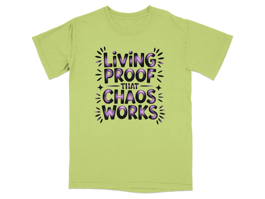 Light green t-shirt with "Living Proof That Chaos Works" in purple text.